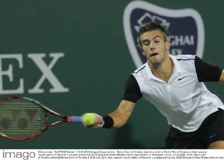 Borna Coric of Croatia returns a shot to Marin Cilic of Croatia in their second round match of the men s singles during the 2015 Shanghai Rolex Masters tennis tournament in Shanghai, China, 13 October 2015. Marin Cilic of Croatia defeated Borna Coric of Croatia 2-0 (6-1 6-2) in their second round match of the men s singles during the 2015 Shanghai Rolex Masters tennis tournament in Shanghai, China, 13 October 2015. Marin Cilic slashes Borna Coric at Shanghai Rolex Masters  pbu344645_13