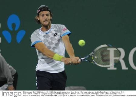 Joao Sousa of Portugal returns a shot to Fabio Fognini of Italy in their first round match of the men s singles during the 2015 Shanghai Rolex Masters tennis tournament in Shanghai, China, 13 October 2015. Fabio Fognini of Italy defeated Joao Sousa of Portugal 2-0 (7-6 6-3) in their first round match of the men s singles during the 2015 Shanghai Rolex Masters tennis tournament in Shanghai, China, 13 October 2015. Fabio Fognini defeats Joao Sousa at Shanghai Rolex Masters  pbu344606_05