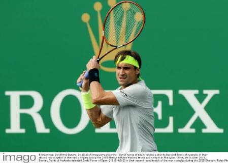 David Ferrer of Spain returns a shot to Bernard Tomic of Australia in their second round match of the men s singles during the 2015 Shanghai Rolex Masters tennis tournament in Shanghai, China, 14 October 2015. Bernard Tomic of Australia defeated David Ferrer of Spain 2-0 (6-4 6-2) in their second round match of the men s singles during the 2015 Shanghai Rolex Masters tennis tournament in Shanghai, China, 14 October 2015. David Ferrer kicked out by Bernard Tomic at Shanghai Rolex Masters  pbu344940_03