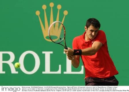 Bernard Tomic of Australia returns a shot to David Ferrer of Spain in their second round match of the men s singles during the 2015 Shanghai Rolex Masters tennis tournament in Shanghai, China, 14 October 2015. Bernard Tomic of Australia defeated David Ferrer of Spain 2-0 (6-4 6-2) in their second round match of the men s singles during the 2015 Shanghai Rolex Masters tennis tournament in Shanghai, China, 14 October 2015. David Ferrer kicked out by Bernard Tomic at Shanghai Rolex Masters  pbu344940_05