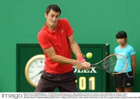 Bernard Tomic of Australia returns a shot to David Ferrer of Spain in their second round match of the men s singles during the 2015 Shanghai Rolex Masters tennis tournament in Shanghai, China, 14 October 2015. Bernard Tomic of Australia defeated David Ferrer of Spain 2-0 (6-4 6-2) in their second round match of the men s singles during the 2015 Shanghai Rolex Masters tennis tournament in Shanghai, China, 14 October 2015. David Ferrer kicked out by Bernard Tomic at Shanghai Rolex Masters  pbu344940_15