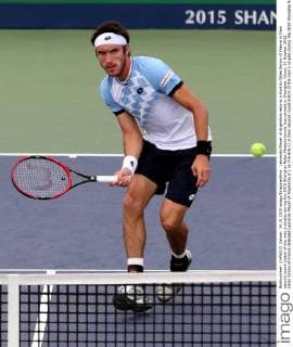 Leonardo Mayer of Argentina returns a shot to Gilles Simon of France in their second round match of the men s singles during the 2015 Shanghai Rolex Masters tennis tournament in Shanghai, China, 14 October 2015. Gilles Simon of France defeated Leonardo Mayer of Argentina 2-1 (6-7 6-4 6-2) in their second round match of the men s singles during the 2015 Shanghai Rolex Masters tennis tournament in Shanghai, China, 14 October 2015. Gilles Simon defeats Leonardo Mayer at Shanghai Rolex Masters  pbu345037_12