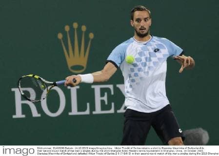 Viktor Troicki of Serbia returns a shot to Stanislas Wawrinka of Switzerland in their second round match of the men s singles during the 2015 Shanghai Rolex Masters tennis tournament in Shanghai, China, 14 October 2015. Stanislas Wawrinka of Switzerland defeated Viktor Troicki of Serbia 2-0 (7-6 6-3) in their second round match of the men s singles during the 2015 Shanghai Rolex Masters tennis tournament in Shanghai, China, 14 October 2015. Stanislas Wawrinka knocks out Viktor Troicki at Shanghai Rolex Masters  pbu345165_15