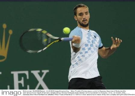 Viktor Troicki of Serbia returns a shot to Stanislas Wawrinka of Switzerland in their second round match of the men s singles during the 2015 Shanghai Rolex Masters tennis tournament in Shanghai, China, 14 October 2015. Stanislas Wawrinka of Switzerland defeated Viktor Troicki of Serbia 2-0 (7-6 6-3) in their second round match of the men s singles during the 2015 Shanghai Rolex Masters tennis tournament in Shanghai, China, 14 October 2015. Stanislas Wawrinka knocks out Viktor Troicki at Shanghai Rolex Masters  pbu345165_17