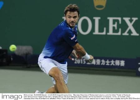 Stanislas Wawrinka of Switzerland returns a shot to Viktor Troicki of Serbia in their second round match of the men s singles during the 2015 Shanghai Rolex Masters tennis tournament in Shanghai, China, 14 October 2015. Stanislas Wawrinka of Switzerland defeated Viktor Troicki of Serbia 2-0 (7-6 6-3) in their second round match of the men s singles during the 2015 Shanghai Rolex Masters tennis tournament in Shanghai, China, 14 October 2015. Stanislas Wawrinka knocks out Viktor Troicki at Shanghai Rolex Masters  pbu345165_18
