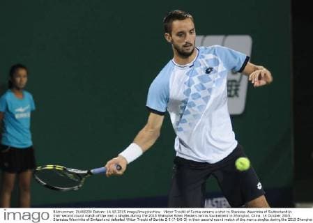 Viktor Troicki of Serbia returns a shot to Stanislas Wawrinka of Switzerland in their second round match of the men s singles during the 2015 Shanghai Rolex Masters tennis tournament in Shanghai, China, 14 October 2015. Stanislas Wawrinka of Switzerland defeated Viktor Troicki of Serbia 2-0 (7-6 6-3) in their second round match of the men s singles during the 2015 Shanghai Rolex Masters tennis tournament in Shanghai, China, 14 October 2015. Stanislas Wawrinka knocks out Viktor Troicki at Shanghai Rolex Masters  pbu345165_26
