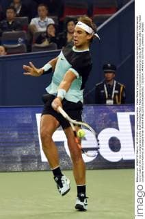 Rafael Nadal of Spain returns a shot to Ivo Karlovic of Croatia in their second round match of the men s singles during the 2015 Shanghai Rolex Masters tennis tournament in Shanghai, China, 14 October 2015. Rafael Nadal competes with Ivo Karlovic at Shanghai Rolex Masters  20151014_14046