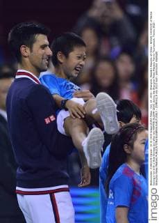 Oct. 14, 2015 - Shanghai, People s Republic of China - NOVAK DJOKOVIC of Serbia having a fun with a little Chinese boy after win MARTIN KLIZAN (SVK) during the Shanghai Rolex Masters Tennis Tournament. Tennis 2015 - Shanghai Rolex Masters  - ZUMAm119