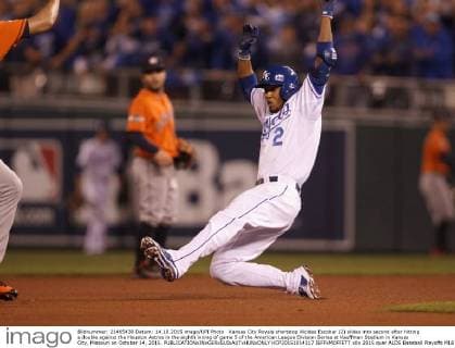 Kansas City Royals shortstop Alcides Escobar (2) slides into second after hitting a double against the Houston Astros in the eighth inning of game 5 of the American League Division Series at Kauffman Stadium in Kansas City, Missouri on October 14, 2015.  KCP20151014117 JEFFxMOFFETT