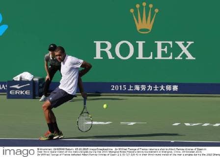Jo-Wilfried Tsonga of France returns a shot to Albert Ramos-Vinolas of Spain in their third round match of the men s singles during the 2015 Shanghai Rolex Masters tennis tournament in Shanghai, China, 15 October 2015. Jo-Wilfried Tsonga of France defeated Albert Ramos-Vinolas of Spain 2-1 (6-7 7-5 6-4) in their third round match of the men s singles during the 2015 Shanghai Rolex Masters tennis tournament in Shanghai, China, 15 October 2015. Jo-Wilfried Tsonga defeats Albert Ramos-Vinolas at Shanghai Rolex Masters  20151015_63760