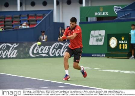 Novak Djokovic of Serbia returns a shot to Feliciano Lopez of Spain in their third round match of the men s singles during the 2015 Shanghai Rolex Masters tennis tournament in Shanghai, China, 15 October 2015. Novak Djokovic of Serbia defeated Feliciano Lopez of Spain 2-0 (6-2 6-3) in their third round match of the men s singles during the 2015 Shanghai Rolex Masters tennis tournament in Shanghai, China, 15 October 2015. Novak Djokovic conquers Feliciano Lopez at Shanghai Rolex Masters  20151015_49628