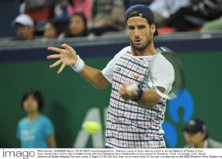 Feliciano Lopez of Spain returns a shot to Novak Djokovic of Serbia in their third round match of the men s singles during the 2015 Shanghai Rolex Masters tennis tournament in Shanghai, China, 15 October 2015. Novak Djokovic of Serbia defeated Feliciano Lopez of Spain 2-0 (6-2 6-3) in their third round match of the men s singles during the 2015 Shanghai Rolex Masters tennis tournament in Shanghai, China, 15 October 2015. Novak Djokovic conquers Feliciano Lopez at Shanghai Rolex Masters  pbu345737_13
