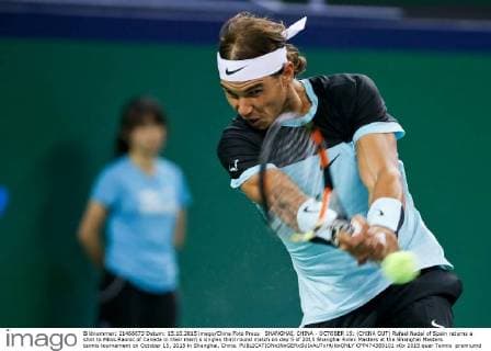 SHANGHAI, CHINA - OCTOBER 15: (CHINA OUT) Rafael Nadal of Spain returns a shot to Milos Raonic of Canada in their men s singles third round match on day 5 of 2015 Shanghai Rolex Masters at the Shanghai Masters tennis tournament on October 15, 2015 in Shanghai, China.  CFP474385101 