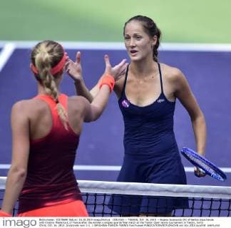 (151016) -- TIANJIN, Oct. 16, 2015 -- Bojana Jovanovski (R) of Serbia claps hands with Kristina Mladenovic of France after the women s singles quarterfinal match at the Tianjin Open tennis tournament in Tianjin, north China, Oct. 16, 2015. Jovanovski won 2-1. ) (SP)CHINA-TIANJIN-TENNIS YuexYuewei 