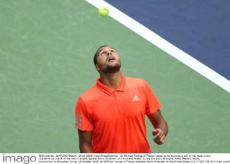 Jo-Wilfried Tsonga of France reacts as he bounces a ball on his head in the quarter-final match of the men s singles against Kevin Anderson of the United States during the 2015 Shanghai Rolex Masters tennis tournament in Shanghai, China, 16 October 2015. Jo-Wilfried Tsonga of France defeated Kevin Anderson of the United States 2-1 (7-6 5-7 6-4) in their quarter-final match of the men s singles during the 2015 Shanghai Rolex Masters tennis tournament in Shanghai, China, 16 October 2015. Jo-Wilfried Tsonga eliminates Kevin Anderson to advance to semi-final at Shanghai Rolex Masters  20151016_63909
