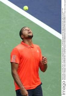 Jo-Wilfried Tsonga of France reacts as he bounces a ball on his head in the quarter-final match of the men s singles against Kevin Anderson of the United States during the 2015 Shanghai Rolex Masters tennis tournament in Shanghai, China, 16 October 2015. Jo-Wilfried Tsonga of France defeated Kevin Anderson of the United States 2-1 (7-6 5-7 6-4) in their quarter-final match of the men s singles during the 2015 Shanghai Rolex Masters tennis tournament in Shanghai, China, 16 October 2015. Jo-Wilfried Tsonga eliminates Kevin Anderson to advance to semi-final at Shanghai Rolex Masters  20151016_63911