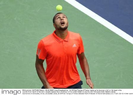 Jo-Wilfried Tsonga of France reacts as he bounces a ball on his head in the quarter-final match of the men s singles against Kevin Anderson of the United States during the 2015 Shanghai Rolex Masters tennis tournament in Shanghai, China, 16 October 2015. Jo-Wilfried Tsonga of France defeated Kevin Anderson of the United States 2-1 (7-6 5-7 6-4) in their quarter-final match of the men s singles during the 2015 Shanghai Rolex Masters tennis tournament in Shanghai, China, 16 October 2015. Jo-Wilfried Tsonga eliminates Kevin Anderson to advance to semi-final at Shanghai Rolex Masters  20151016_10025