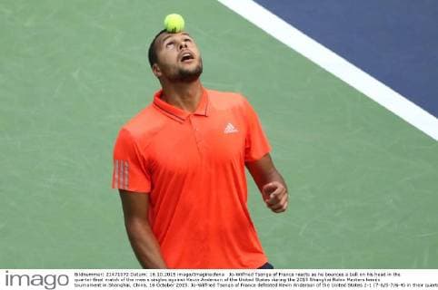 Jo-Wilfried Tsonga of France reacts as he bounces a ball on his head in the quarter-final match of the men s singles against Kevin Anderson of the United States during the 2015 Shanghai Rolex Masters tennis tournament in Shanghai, China, 16 October 2015. Jo-Wilfried Tsonga of France defeated Kevin Anderson of the United States 2-1 (7-6 5-7 6-4) in their quarter-final match of the men s singles during the 2015 Shanghai Rolex Masters tennis tournament in Shanghai, China, 16 October 2015. Jo-Wilfried Tsonga eliminates Kevin Anderson to advance to semi-final at Shanghai Rolex Masters  20151016_10026
