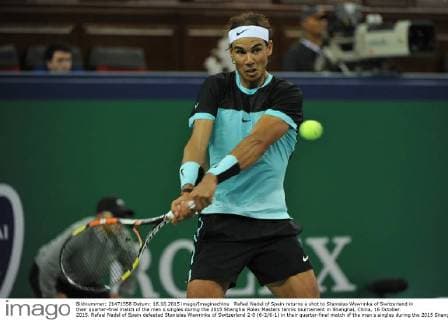 Rafael Nadal of Spain returns a shot to Stanislas Wawrinka of Switzerland in their quarter-final match of the men s singles during the 2015 Shanghai Rolex Masters tennis tournament in Shanghai, China, 16 October 2015. Rafael Nadal of Spain defeated Stanislas Wawrinka of Switzerland 2-0 (6-2 6-1) in their quarter-final match of the men s singles during the 2015 Shanghai Rolex Masters tennis tournament in Shanghai, China, 16 October 2015. Rafael Nadal ousts Stanislas Wawrinka to advance to semi-final at Shanghai Rolex Masters  pbu346235_06