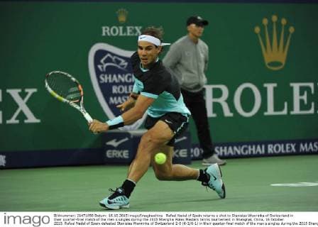 Rafael Nadal of Spain returns a shot to Stanislas Wawrinka of Switzerland in their quarter-final match of the men s singles during the 2015 Shanghai Rolex Masters tennis tournament in Shanghai, China, 16 October 2015. Rafael Nadal of Spain defeated Stanislas Wawrinka of Switzerland 2-0 (6-2 6-1) in their quarter-final match of the men s singles during the 2015 Shanghai Rolex Masters tennis tournament in Shanghai, China, 16 October 2015. Rafael Nadal ousts Stanislas Wawrinka to advance to semi-final at Shanghai Rolex Masters  pbu346245_17