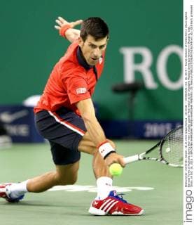(151016) -- SHANGHAI, Oct. 16, 2015 -- Novak Djokovic of Serbia hits a return against Bernard Tomic of Australia during their men s singles quarter-final match at the Shanghai Masters tennis tournament in Shanghai, east China, on Oct. 16, 2015. ) (SP)CHINA-SHANGHAI-TENNIS-SHANGHAI MASTERS (CN) FanxJun 