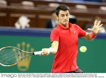 (151016) -- SHANGHAI, Oct. 16, 2015 -- Bernard Tomic of Australia hits a return against Novak Djokovic of Serbia during their men s singles quarter-final match at the Shanghai Masters tennis tournament in Shanghai, east China, on Oct. 16, 2015. ) (SP)CHINA-SHANGHAI-TENNIS-SHANGHAI MASTERS (CN) FanxJun 