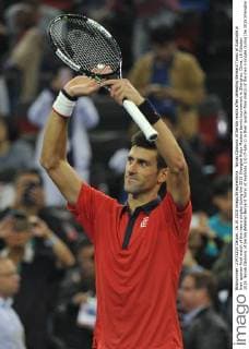 Novak Djokovic of Serbia reacts after defeating Bernard Tomic of Australia in their quarter-final match of the men s singles during the 2015 Shanghai Rolex Masters tennis tournament in Shanghai, China, 16 October 2015. Novak Djokovic of Serbia defeated Bernard Tomic of Australia 2-0 (7-6 6-1) in their quarter-final match of the men s singles during the 2015 Shanghai Rolex Masters tennis tournament in Shanghai, China, 16 October 2015. Novak Djokovic kicks out Bernard Tomic to advance to semi-final at Shanghai Rolex Masters  pbu346293_11