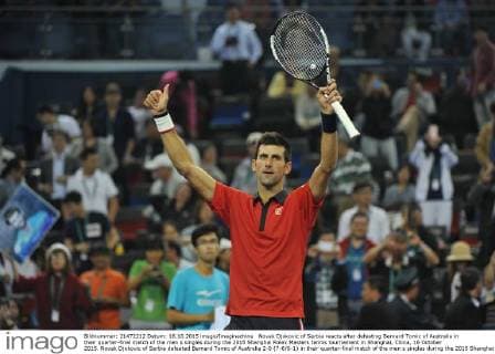 Novak Djokovic of Serbia reacts after defeating Bernard Tomic of Australia in their quarter-final match of the men s singles during the 2015 Shanghai Rolex Masters tennis tournament in Shanghai, China, 16 October 2015. Novak Djokovic of Serbia defeated Bernard Tomic of Australia 2-0 (7-6 6-1) in their quarter-final match of the men s singles during the 2015 Shanghai Rolex Masters tennis tournament in Shanghai, China, 16 October 2015. Novak Djokovic kicks out Bernard Tomic to advance to semi-final at Shanghai Rolex Masters  pbu346293_13