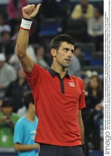 Novak Djokovic of Serbia reacts after defeating Bernard Tomic of Australia in their quarter-final match of the men s singles during the 2015 Shanghai Rolex Masters tennis tournament in Shanghai, China, 16 October 2015. Novak Djokovic of Serbia defeated Bernard Tomic of Australia 2-0 (7-6 6-1) in their quarter-final match of the men s singles during the 2015 Shanghai Rolex Masters tennis tournament in Shanghai, China, 16 October 2015. Novak Djokovic kicks out Bernard Tomic to advance to semi-final at Shanghai Rolex Masters  pbu346293_07