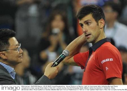 Novak Djokovic of Serbia, right, is interviewed after defeating Bernard Tomic of Australia in their quarter-final match of the men s singles during the 2015 Shanghai Rolex Masters tennis tournament in Shanghai, China, 16 October 2015. Novak Djokovic of Serbia defeated Bernard Tomic of Australia 2-0 (7-6 6-1) in their quarter-final match of the men s singles during the 2015 Shanghai Rolex Masters tennis tournament in Shanghai, China, 16 October 2015. Novak Djokovic kicks out Bernard Tomic to advance to semi-final at Shanghai Rolex Masters  pbu346295_06