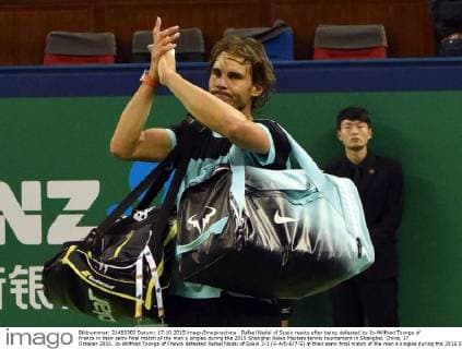 Rafael Nadal of Spain reacts after being defeated by Jo-Wilfried Tsonga of France in their semi-final match of the men s singles during the 2015 Shanghai Rolex Masters tennis tournament in Shanghai, China, 17 October 2015. Jo-Wilfried Tsonga of France defeated Rafael Nadal of Spain 2-1 (6-4 0-6 7-5) in their semi-final match of the men s singles during the 2015 Shanghai Rolex Masters tennis tournament in Shanghai, China, 17 October 2015. Jo-Wilfried Tsonga ousts Rafael Nadal to advance to final at Shanghai Rolex Masters  20151017_09771
