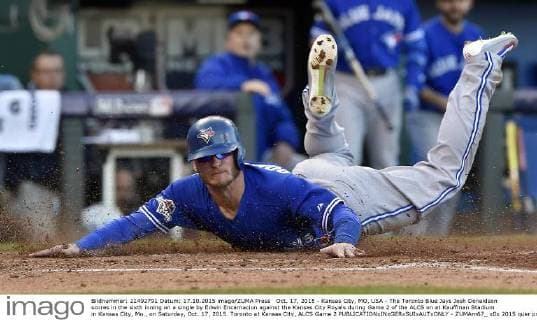 Oct. 17, 2015 - Kansas City, MO, USA - The Toronto Blue Jays Josh Donaldson scores in the sixth inning on a single by Edwin Encarnacion against the Kansas City Royals during Game 2 of the ALCS on at Kauffman Stadium in Kansas City, Mo., on Saturday, Oct. 17, 2015. Toronto at Kansas City, ALCS Game 2 - ZUMAm67_