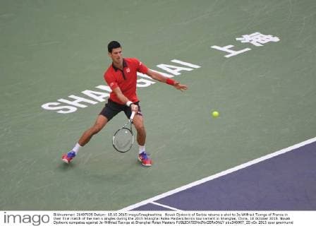 Novak Djokovic of Serbia returns a shot to Jo-Wilfried Tsonga of France in their final match of the men s singles during the 2015 Shanghai Rolex Masters tennis tournament in Shanghai, China, 18 October 2015. Novak Djokovic competes against Jo-Wilfried Tsonga at Shanghai Rolex Masters  pbu346987_20