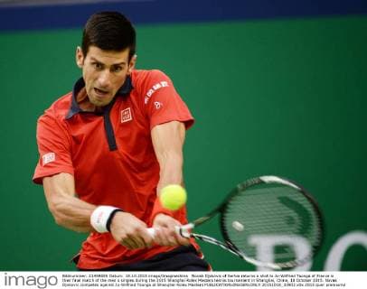 Novak Djokovic of Serbia returns a shot to Jo-Wilfried Tsonga of France in their final match of the men s singles during the 2015 Shanghai Rolex Masters tennis tournament in Shanghai, China, 18 October 2015. Novak Djokovic competes against Jo-Wilfried Tsonga at Shanghai Rolex Masters  20151018_33902