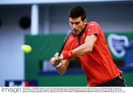 Novak Djokovic of Serbia returns a shot to Jo-Wilfried Tsonga of France in their final match of the men s singles during the 2015 Shanghai Rolex Masters tennis tournament in Shanghai, China, 18 October 2015. Novak Djokovic competes against Jo-Wilfried Tsonga at Shanghai Rolex Masters  20151018_64982