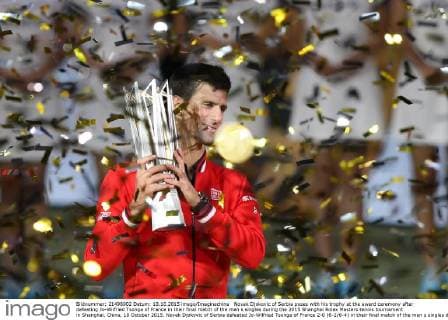 Novak Djokovic of Serbia poses with his trophy at the award ceremony after defeating Jo-Wilfried Tsonga of France in their final match of the men s singles during the 2015 Shanghai Rolex Masters tennis tournament in Shanghai, China, 18 October 2015. Novak Djokovic of Serbia defeated Jo-Wilfried Tsonga of France 2-0 (6-2 6-4) in their final match of the men s singles during the 2015 Shanghai Rolex Masters tennis tournament in Shanghai, China, 18 October 2015. Djokovic defeats Jo-Wilfried Tsonga to win Shanghai Masters final  20151018_65937