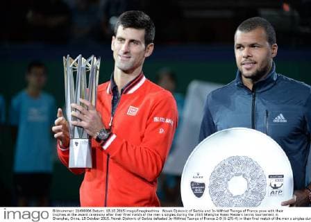 Novak Djokovic of Serbia and Jo-Wilfried Tsonga of France pose with their trophies at the award ceremony after their final match of the men s singles during the 2015 Shanghai Rolex Masters tennis tournament in Shanghai, China, 18 October 2015. Novak Djokovic of Serbia defeated Jo-Wilfried Tsonga of France 2-0 (6-2 6-4) in their final match of the men s singles during the 2015 Shanghai Rolex Masters tennis tournament in Shanghai, China, 18 October 2015. Djokovic defeats Jo-Wilfried Tsonga to win Shanghai Masters final  20151018_12276
