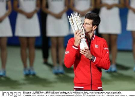 Novak Djokovic of Serbia kisses his trophy at the award ceremony after defeating Jo-Wilfried Tsonga of France in their final match of the men s singles during the 2015 Shanghai Rolex Masters tennis tournament in Shanghai, China, 18 October 2015. Novak Djokovic of Serbia defeated Jo-Wilfried Tsonga of France 2-0 (6-2 6-4) in their final match of the men s singles during the 2015 Shanghai Rolex Masters tennis tournament in Shanghai, China, 18 October 2015. Djokovic defeats Jo-Wilfried Tsonga to win Shanghai Masters final  20151018_12298