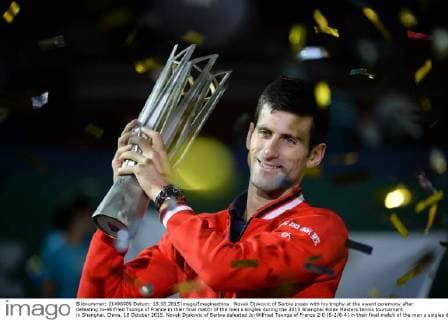 Novak Djokovic of Serbia poses with his trophy at the award ceremony after defeating Jo-Wilfried Tsonga of France in their final match of the men s singles during the 2015 Shanghai Rolex Masters tennis tournament in Shanghai, China, 18 October 2015. Novak Djokovic of Serbia defeated Jo-Wilfried Tsonga of France 2-0 (6-2 6-4) in their final match of the men s singles during the 2015 Shanghai Rolex Masters tennis tournament in Shanghai, China, 18 October 2015. Djokovic defeats Jo-Wilfried Tsonga to win Shanghai Masters final  20151018_34916
