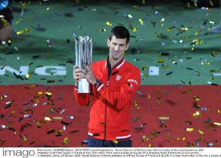 Novak Djokovic of Serbia poses with his trophy at the award ceremony after defeating Jo-Wilfried Tsonga of France in their final match of the men s singles during the 2015 Shanghai Rolex Masters tennis tournament in Shanghai, China, 18 October 2015. Novak Djokovic of Serbia defeated Jo-Wilfried Tsonga of France 2-0 (6-2 6-4) in their final match of the men s singles during the 2015 Shanghai Rolex Masters tennis tournament in Shanghai, China, 18 October 2015. Djokovic defeats Jo-Wilfried Tsonga to win Shanghai Masters final  pbu347071_01