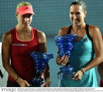 Jelena Jankovic of Serbia, right, and Angelique Kerber of Germany hold their trophies of champion and runner-up respectively at the award ceremony after their final match of the women s singles during the 2015 Hong Kong Open tennis tournament in Hong Kong, China, 18 October 2015. Jelena Jankovic of Serbia defeated Angelique Kerber of Germany 2-1 (3-6 7-6 6-1) in their final match of the women s singles during the 2015 Hong Kong Open tennis tournament in Hong Kong, China, 18 October 2015. Jelena Jankovic crowns Hong Kong Open title  20151019_25100