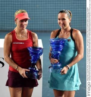 Jelena Jankovic of Serbia, right, and Angelique Kerber of Germany hold their trophies of champion and runner-up respectively at the award ceremony after their final match of the women s singles during the 2015 Hong Kong Open tennis tournament in Hong Kong, China, 18 October 2015. Jelena Jankovic of Serbia defeated Angelique Kerber of Germany 2-1 (3-6 7-6 6-1) in their final match of the women s singles during the 2015 Hong Kong Open tennis tournament in Hong Kong, China, 18 October 2015. Jelena Jankovic crowns Hong Kong Open title  20151019_56925