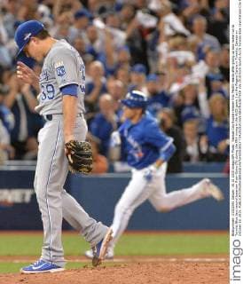 Kansas City Royals reliever Kris Medlin reacts after giving up solo home run to Toronto Blue Jays second baseman Ryan Goins (R) during the fifth inning in the ALCS game 3 at the Rogers Centre in Toronto, Canada on October 19, 2015.  TOR2015101925 KEVINxDIETSCH