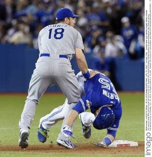 Oct. 19, 2015 - Toronto, CAN - Toronto Blue Jays catcher Russell Martin crashes into second base after being forced out on a throw from Kansas City Royals shortstop Alcides Escobar to second baseman Ben Zobrist during the second inning on Monday, Oct. 19, 2015, at Rogers Centre in Toronto. Kansas City Royals at Toronto Blue Jays - ZUMAm67_