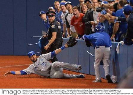 Kansas City Royals right fielder Alex Rios slides into the wall chasing a pop fly by Toronto Blue Jays Jose Bautista during the third inning in the ALCS game 4 at the Rogers Centre in Toronto, Canada on October 20, 2015.  TOR2015102023 KEVINxDIETSCH