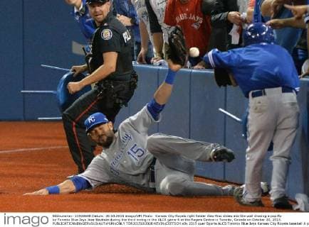 Kansas City Royals right fielder Alex Rios slides into the wall chasing a pop fly by Toronto Blue Jays Jose Bautista during the third inning in the ALCS game 4 at the Rogers Centre in Toronto, Canada on October 20, 2015.  TOR2015102026 KEVINxDIETSCH