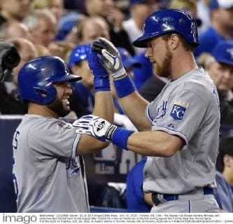 Oct. 20, 2015 - Toronto, ON, CAN - The Kansas City Royals Kendrys Morales, left, welcomes Ben Zobrist back to the dugout after Zobrist hit a two-run home run in the first inning against the Toronto Blue Jays during Game 4 of the ALCS on Tuesday, Oct. 20, 2015, at Rogers Centre in Toronto. Kansas City at Toronto, ALCS Game 4 - ZUMAm67_