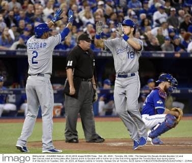 Oct. 20, 2015 - Toronto, ON, CAN - The Kansas City Royals Alcides Escobar (2) and Ben Zobrist meet at home plate after Zobrist drove in Escobar with a home run in the first inning against the Toronto Blue Jays during Game 4 of the ALCS on Tuesday, Oct. 20, 2015, at Rogers Centre in Toronto. Kansas City at Toronto, ALCS Game 4 - ZUMAm67_