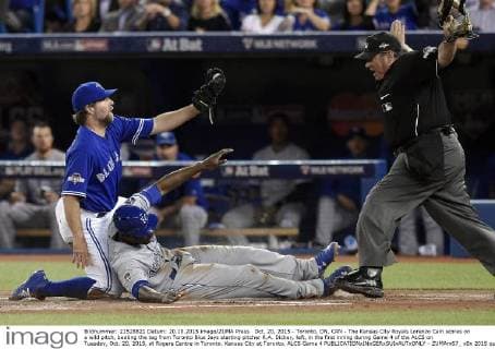 Oct. 20, 2015 - Toronto, ON, CAN - The Kansas City Royals Lorenzo Cain scores on a wild pitch, beating the tag from Toronto Blue Jays starting pitcher R.A. Dickey, left, in the first inning during Game 4 of the ALCS on Tuesday, Oct. 20, 2015, at Rogers Centre in Toronto. Kansas City at Toronto, ALCS Game 4 - ZUMAm67_