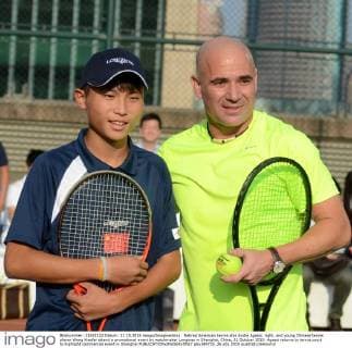 Retired American tennis star Andre Agassi, right, and young Chinese tennis player Wang Xiaofei attend a promotional event by watchmaker Longines in Shanghai, China, 21 October 2015. Agassi returns to tennis court to highlight commercial event in Shanghai  pbu348725_26